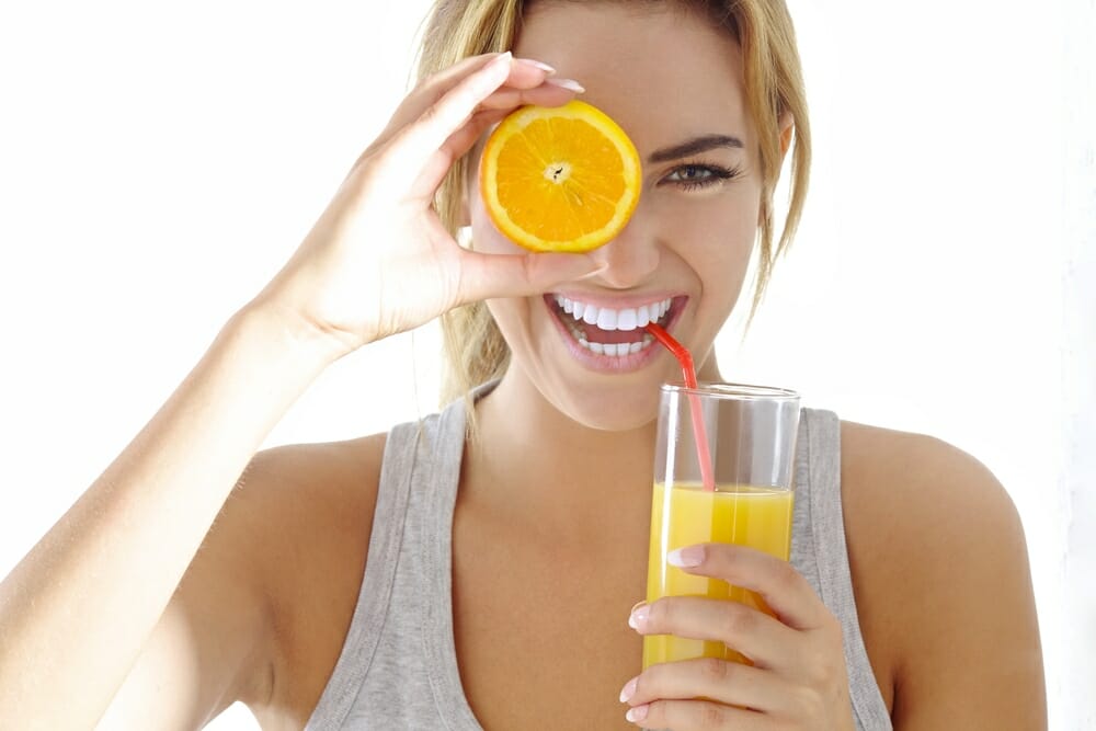 young woman with orange juice